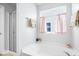 Bright bathroom featuring a soaking tub, frameless shower and neutral decor at 15444 Old Pond Cir, Noblesville, IN 46060
