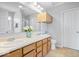 Bathroom featuring a double sink vanity, linen storage, and neutral paint at 15444 Old Pond Cir, Noblesville, IN 46060
