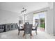 Dining area with modern pendant lighting and a view of the backyard at 15444 Old Pond Cir, Noblesville, IN 46060