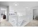 Second floor hallway landing with white spindled railing and lots of natural light at 15444 Old Pond Cir, Noblesville, IN 46060