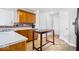 Kitchen featuring light wood cabinets, a peninsula, and tile floors at 15444 Old Pond Cir, Noblesville, IN 46060