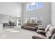 Open-concept living room and dining area with high ceilings and lots of natural light at 15444 Old Pond Cir, Noblesville, IN 46060