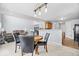 An open concept living space with a dining area, living room, and stairs to the second floor at 15444 Old Pond Cir, Noblesville, IN 46060