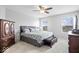 Spacious main bedroom with neutral decor, ceiling fan and lots of natural light at 15444 Old Pond Cir, Noblesville, IN 46060