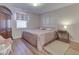 Comfortable bedroom with natural light, cozy rug, and traditional furniture at 1739 Wellesley Commons # 48A, Indianapolis, IN 46219