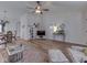 Bright living room featuring hardwood floors, a ceiling fan, and comfortable seating at 1739 Wellesley Commons # 48A, Indianapolis, IN 46219