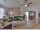 Cozy living room featuring hardwood floors, a ceiling fan, and comfortable seating at 1739 Wellesley Commons # 48A, Indianapolis, IN 46219
