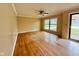 A living room with hardwood floors and neutral walls, featuring a ceiling fan at 1761 Country Lane Dr, Greenfield, IN 46140