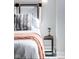 Cozy bedroom with padded headboard, stylish nightstand and minimalist decor at 1802 Bellefontaine St, Indianapolis, IN 46202
