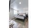 Cozy bedroom featuring a comfortable bed, soft rug, and a bright window with natural light at 1802 Bellefontaine St, Indianapolis, IN 46202