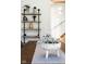 Elegant dining table featuring a decorative centerpiece, complemented by open shelving at 1802 Bellefontaine St, Indianapolis, IN 46202