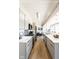 Sleek kitchen with stainless steel appliances and stone countertops open to the living space at 1802 Bellefontaine St, Indianapolis, IN 46202