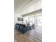 Contemporary living room with large windows, gray sofa, and modern decor at 1802 Bellefontaine St, Indianapolis, IN 46202
