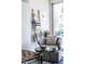 Comfortable sitting area with stylish chair, throw blanket and natural light from large window at 1802 Bellefontaine St, Indianapolis, IN 46202