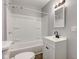 This bathroom is equipped with a shower-tub combo and a white vanity at 1911 Wilcox St, Indianapolis, IN 46222