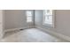 This bedroom has two large windows providing natural light and plush carpet flooring at 1911 Wilcox St, Indianapolis, IN 46222