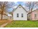 Charming single-Gathering home featuring a quaint front porch and well-maintained lawn at 1911 Wilcox St, Indianapolis, IN 46222