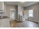 This kitchen features vinyl flooring and access to other rooms of the house at 1911 Wilcox St, Indianapolis, IN 46222
