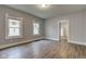Spacious living room featuring wood floors and large windows at 1911 Wilcox St, Indianapolis, IN 46222