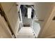 Basement steps lead down to the utility area with a white painted brick support and light grey floor at 1952 N Colorado Ave, Indianapolis, IN 46218