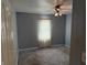 Bedroom with plush carpet, neutral walls, and a ceiling fan, creating a cozy and inviting space at 1952 N Colorado Ave, Indianapolis, IN 46218