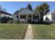 Charming single-story home with a cozy front porch and a well-maintained front yard at 1952 N Colorado Ave, Indianapolis, IN 46218