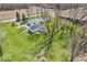 Aerial view of property showing a spacious backyard with trees, shed and a charming single story home with ample parking at 25249 State Road 13 N, Noblesville, IN 46060