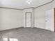 Neutral bedroom with wall-to-wall carpet and a double door closet at 25249 State Road 13 N, Noblesville, IN 46060
