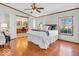 Comfortable bedroom suite featuring a king bed, hardwood floors, and a private bathroom at 25249 State Road 13 N, Noblesville, IN 46060