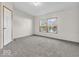 Bright bedroom with natural light streaming through windows and neutral carpet at 25249 State Road 13 N, Noblesville, IN 46060
