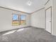 Bright bedroom with natural light streaming through windows and neutral carpet at 25249 State Road 13 N, Noblesville, IN 46060