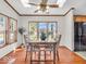 Dining area with wood floors, comfortable seating, a ceiling fan, and natural light at 25249 State Road 13 N, Noblesville, IN 46060