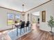 Well-lit dining room showcases laminate floors, contemporary lighting, and an open layout at 25249 State Road 13 N, Noblesville, IN 46060