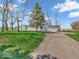 Inviting single-story home with a long driveway and a two-car detached garage at 25249 State Road 13 N, Noblesville, IN 46060
