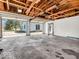 Large garage interior with open doors, offering ample space for vehicles and projects at 25249 State Road 13 N, Noblesville, IN 46060