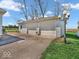 Detached two-car garage with ample parking space and exterior lighting at 25249 State Road 13 N, Noblesville, IN 46060