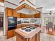 Open kitchen with cooktop island, double oven, and ample cabinet space for storage at 25249 State Road 13 N, Noblesville, IN 46060