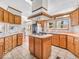 Traditional kitchen with laminate floors, center island, and stainless-steel appliances at 25249 State Road 13 N, Noblesville, IN 46060