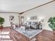 Bright living room with laminate flooring, stylish decor, and a comfortable seating area at 25249 State Road 13 N, Noblesville, IN 46060