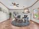 Cozy living room featuring a ceiling fan, fireplace, modern furniture and a sliding glass door at 25249 State Road 13 N, Noblesville, IN 46060