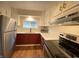 Well-equipped kitchen featuring stainless steel appliances, two-tone cabinets, and ample counter space for culinary adventures at 2528 E 17Th St, Indianapolis, IN 46218