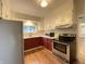 Well-lit kitchen featuring two-toned cabinets, stainless steel appliances, and modern countertops for the home chef at 2528 E 17Th St, Indianapolis, IN 46218