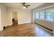 Bright living room boasts hardwood floors and large windows providing ample natural light, creating a comfortable space at 2528 E 17Th St, Indianapolis, IN 46218