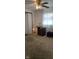 Bedroom with beige carpeting, closet, and ceiling fan at 3002 W 53Rd St, Anderson, IN 46011