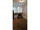 Living room with wheelchair and sofa at 3002 W 53Rd St, Anderson, IN 46011
