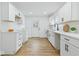 Modern kitchen with white cabinets, stainless steel appliances, and bright natural light at 3105 N Tacoma Ave, Indianapolis, IN 46218