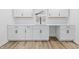 Bright kitchen featuring white cabinetry, stainless steel dishwasher, and a modern design at 3105 N Tacoma Ave, Indianapolis, IN 46218