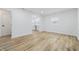 Bright living room featuring modern wood flooring, fresh white paint, new trim and lots of natural light at 3105 N Tacoma Ave, Indianapolis, IN 46218