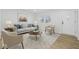 Bright living room with neutral furniture, hardwood floors, a light rug, and natural light at 3105 N Tacoma Ave, Indianapolis, IN 46218
