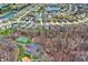This aerial captures a well-planned residential community with a scenic pond, lush landscaping, and inviting homes at 320 Legacy Blvd, Greenwood, IN 46143
